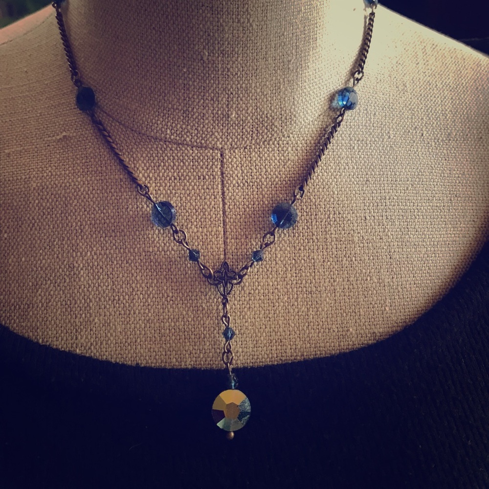 Vintage inspired gold with blue crystals.